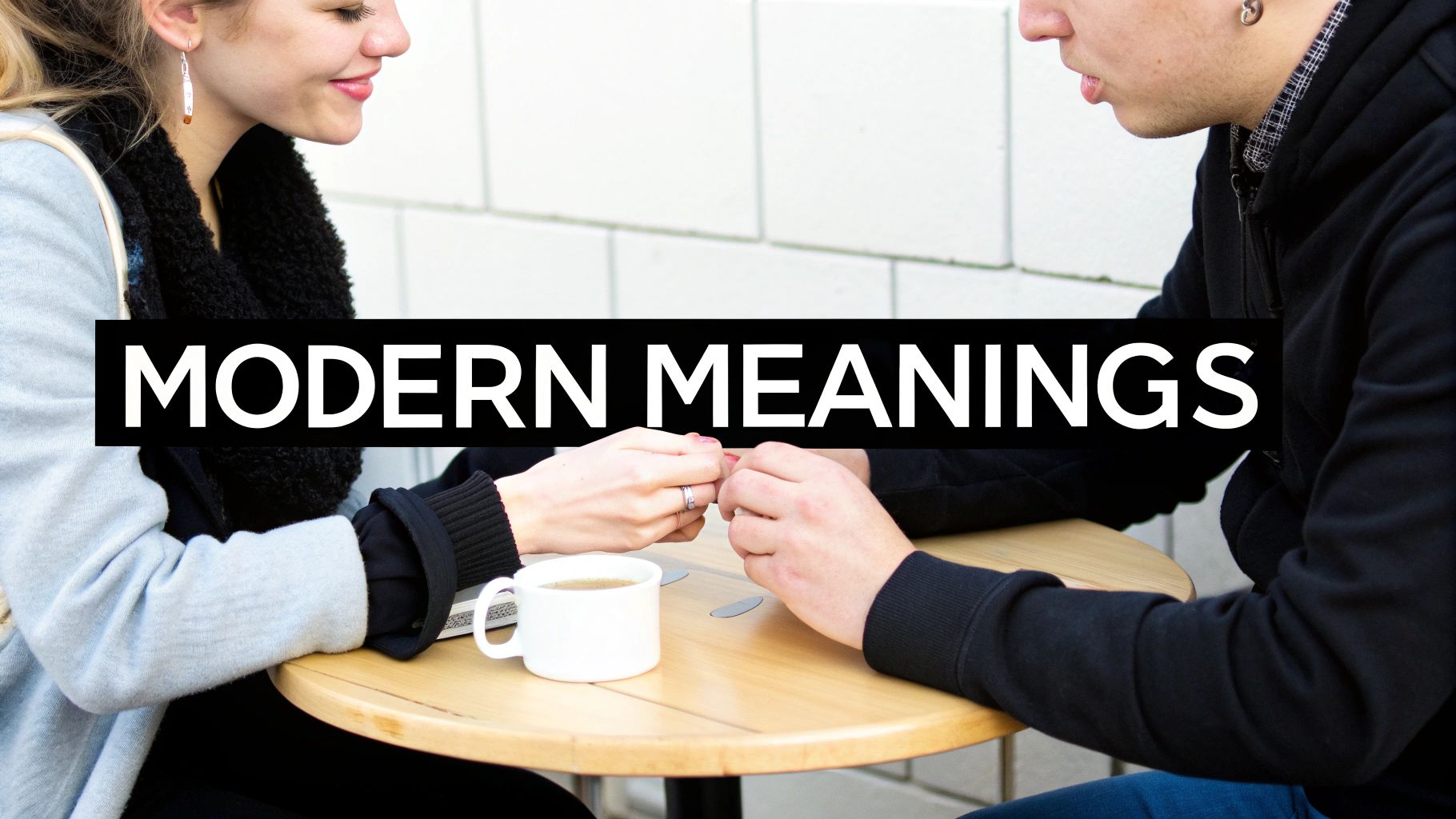 Couple holding hands with a promise ring visible