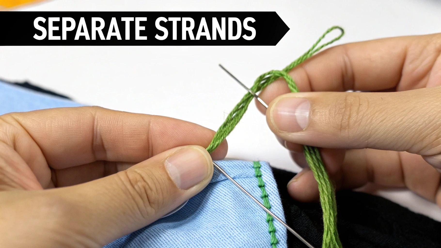 Hands using needle to separate strands of green embroidery floss for hand stitching