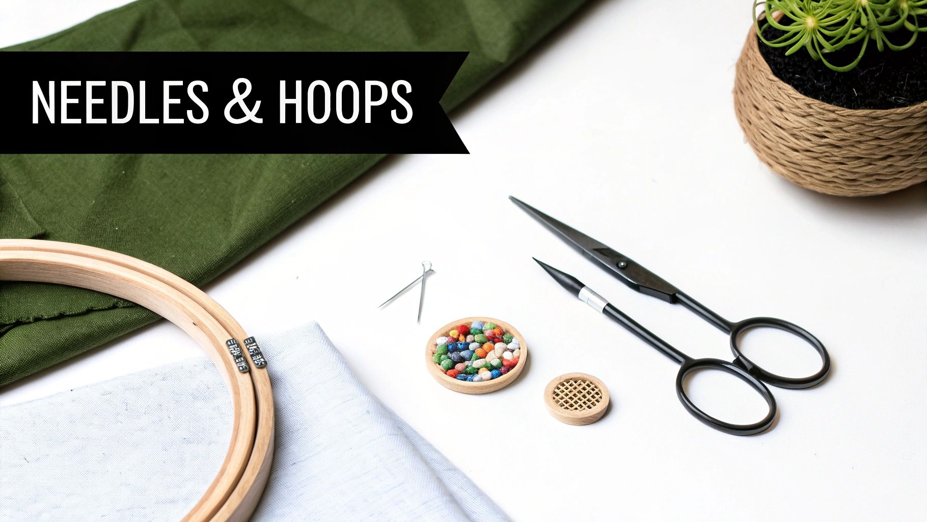 A flat lay of embroidery and cross stitch materials, including hoops, fabric, scissors, and colorful beads.
