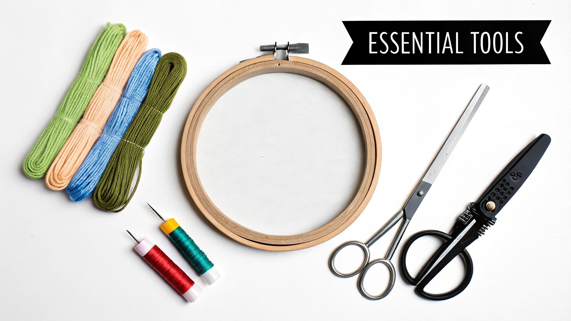 A vibrant collection of cross stitch materials, including colorful threads, fabric, and hoops.