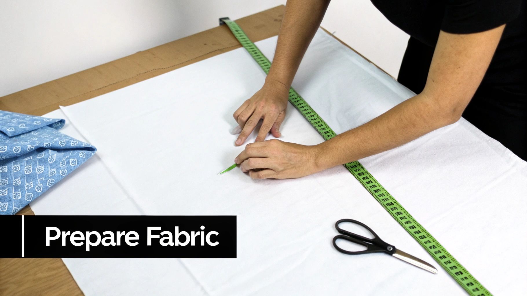 A person's hands holding a piece of Aida fabric with a needle threaded, ready for stitching.