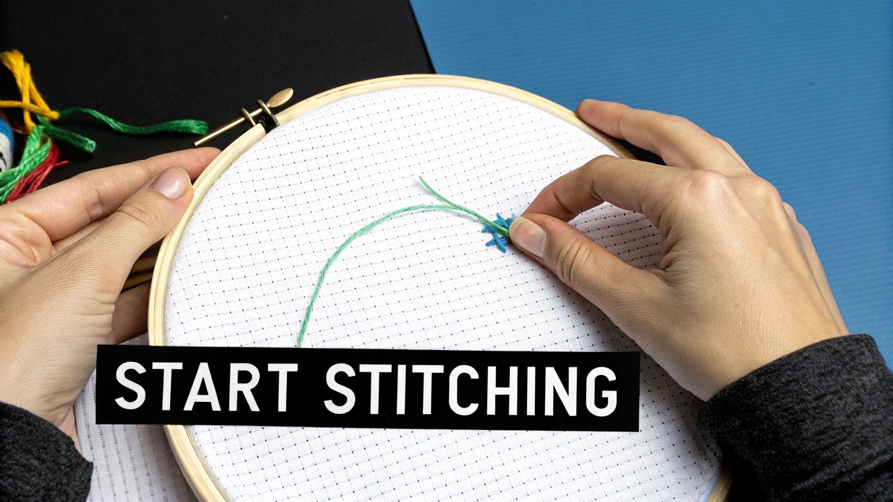 Hands holding an embroidery hoop with cross-stitch fabric and green thread, overlaid with 'START STITCHING' text.
