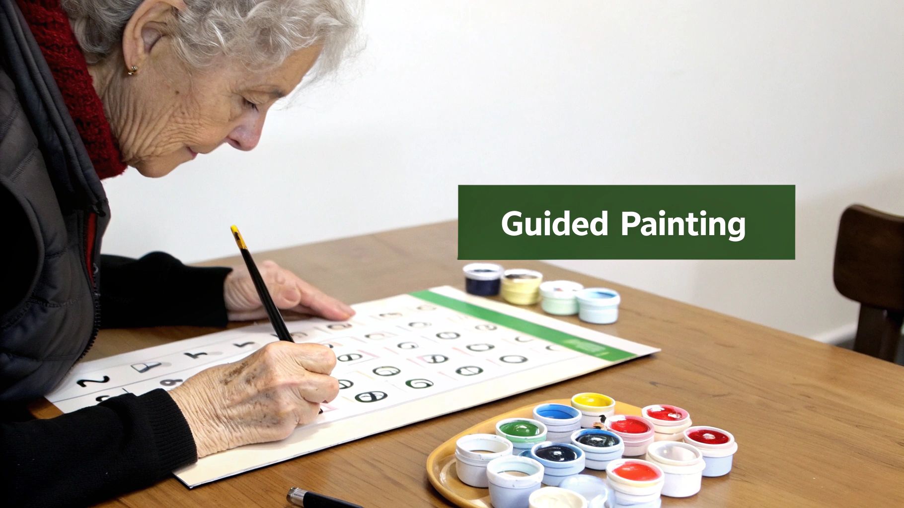An elderly woman engages in a guided painting activity, using a brush and colorful paints.
