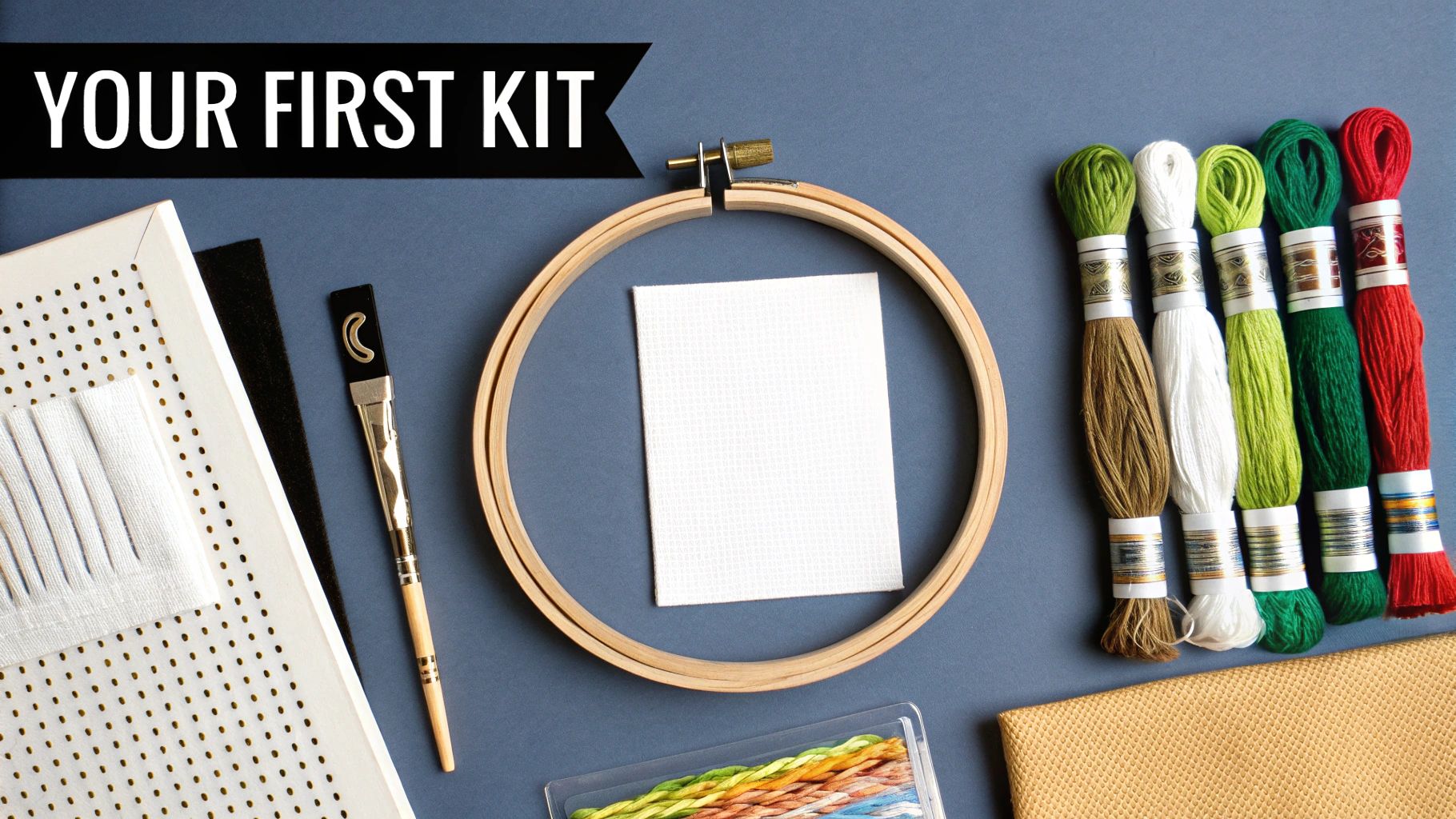 A flat lay of embroidery supplies including a hoop, fabric, colorful floss, and tools, captioned 'YOUR FIRST KIT'.