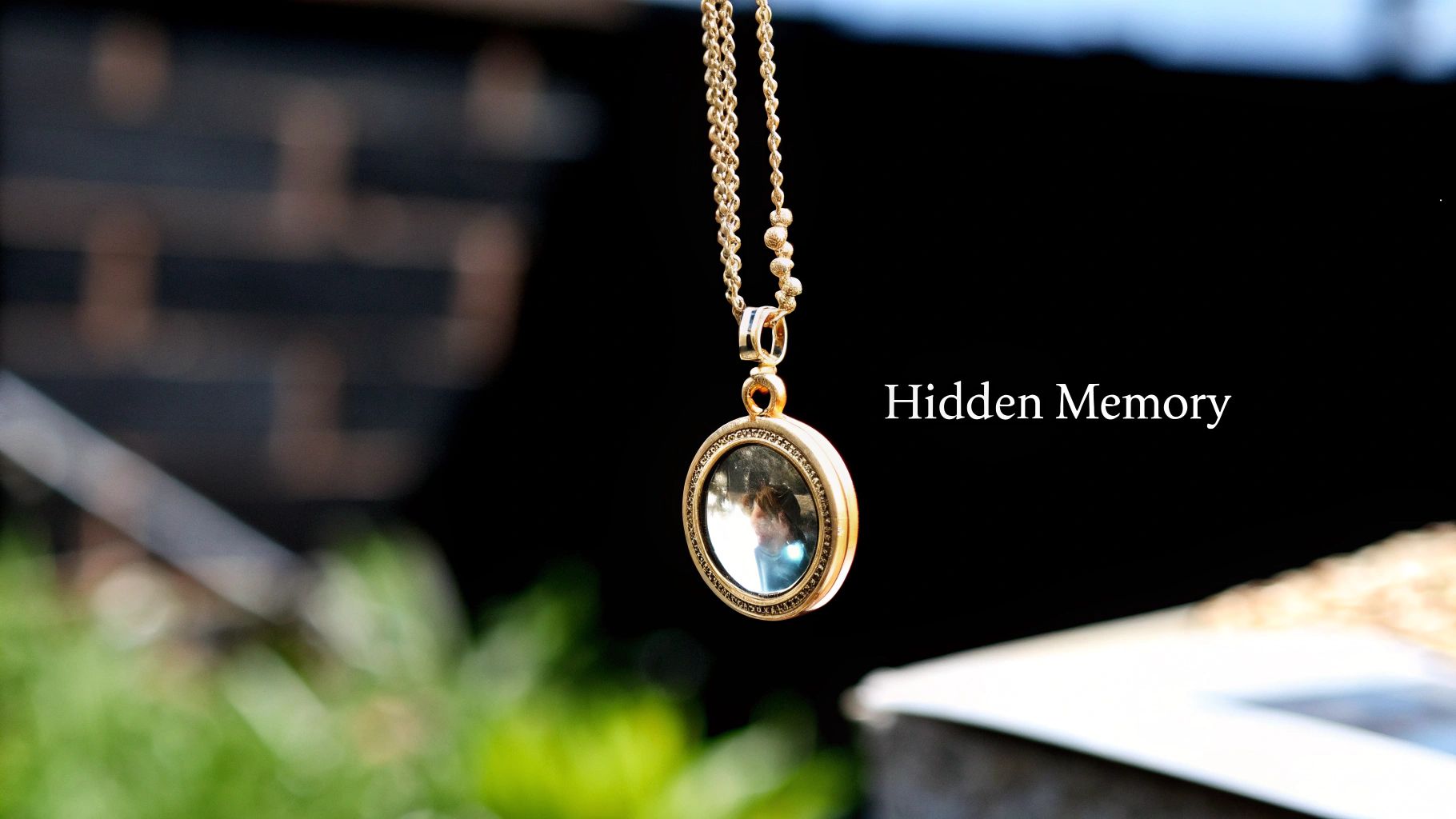 A woman wearing a silver pendant with a picture inside, looking thoughtful.