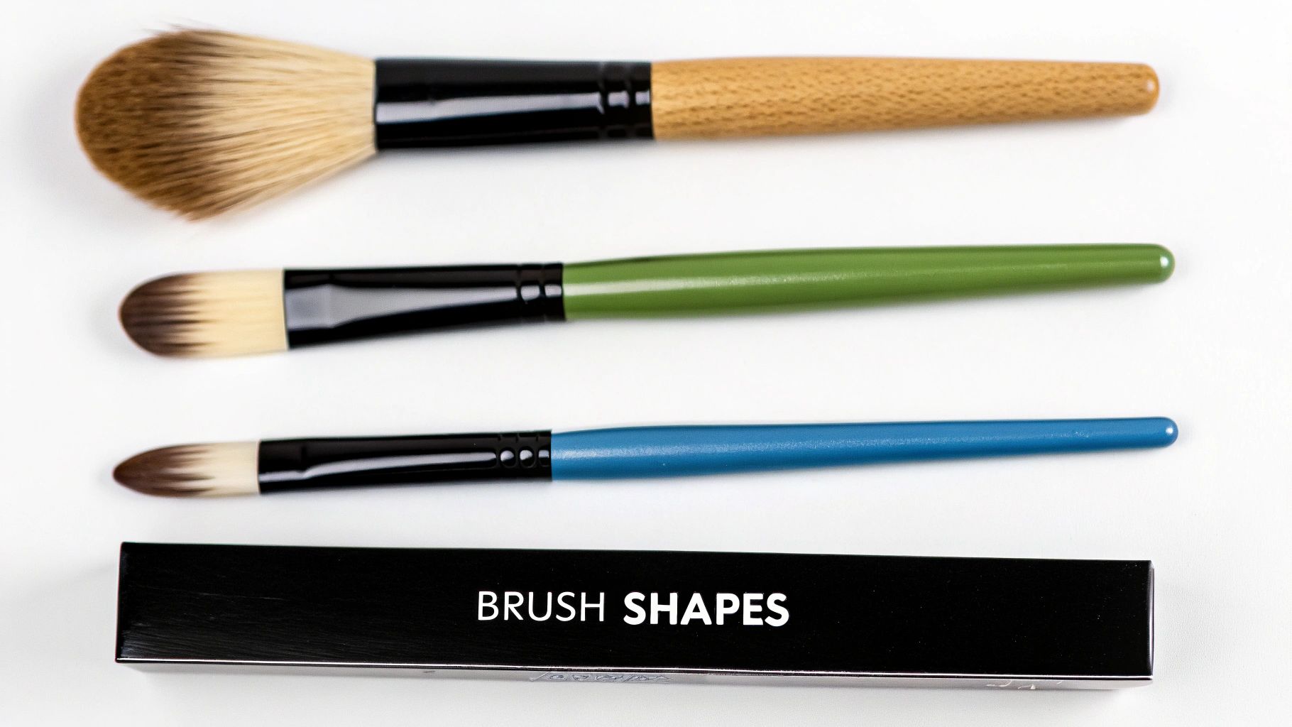 A selection of different shaped paintbrushes for paint by numbers, including round, flat, and detail brushes.