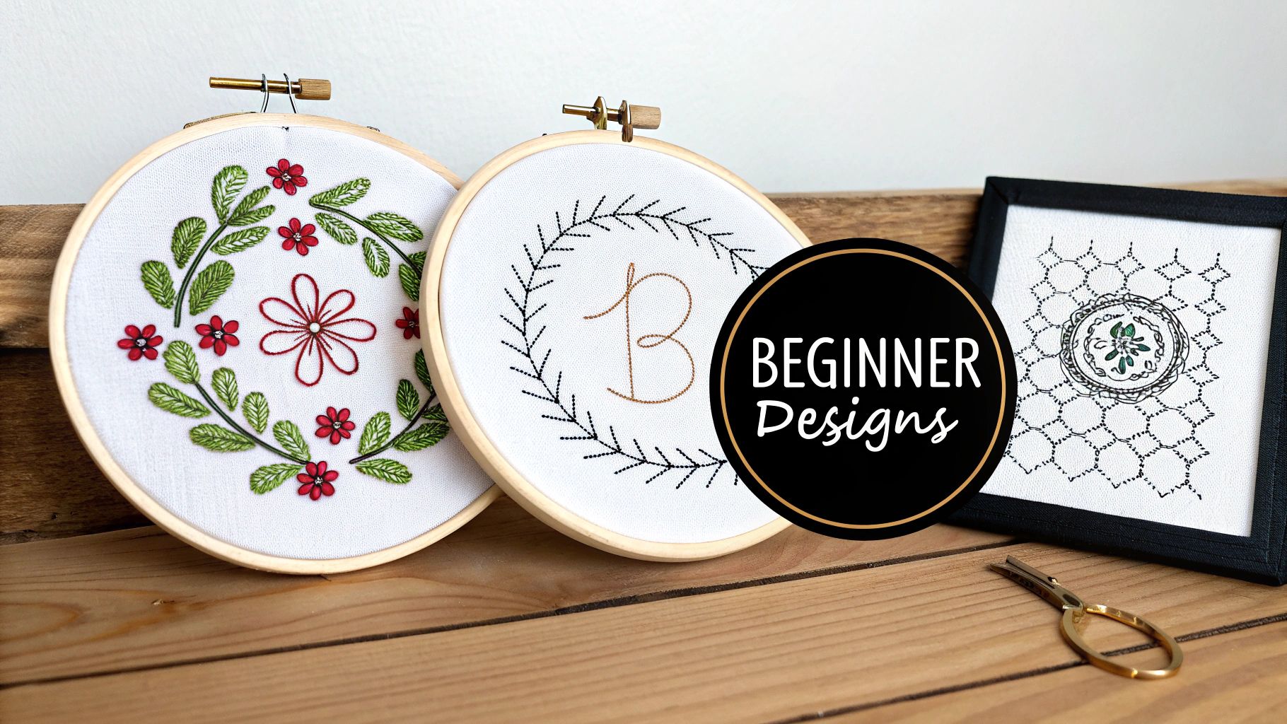 Three beautiful beginner embroidery projects, two in hoops and one framed, displayed on wood.