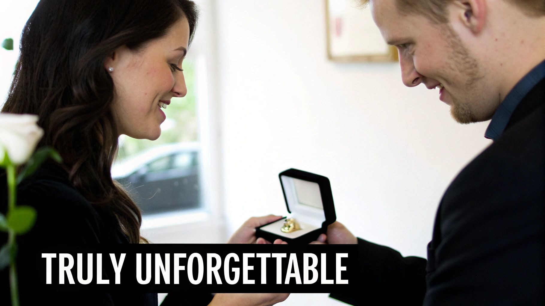 A man proposes to a smiling woman with an engagement ring in a velvet box.