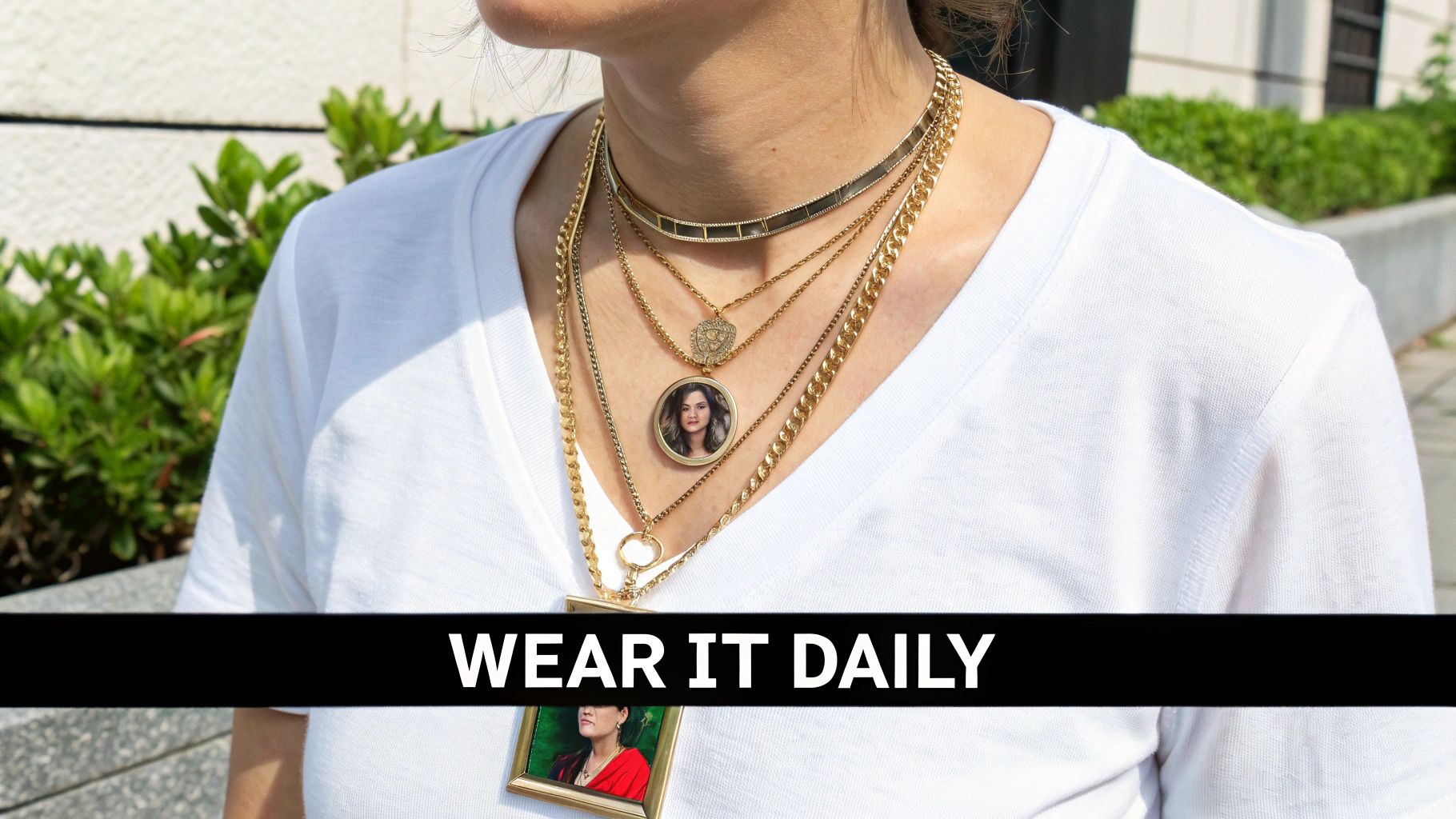A stylish woman wearing a layered necklace look, with a personalized photo pendant necklace as the centerpiece.