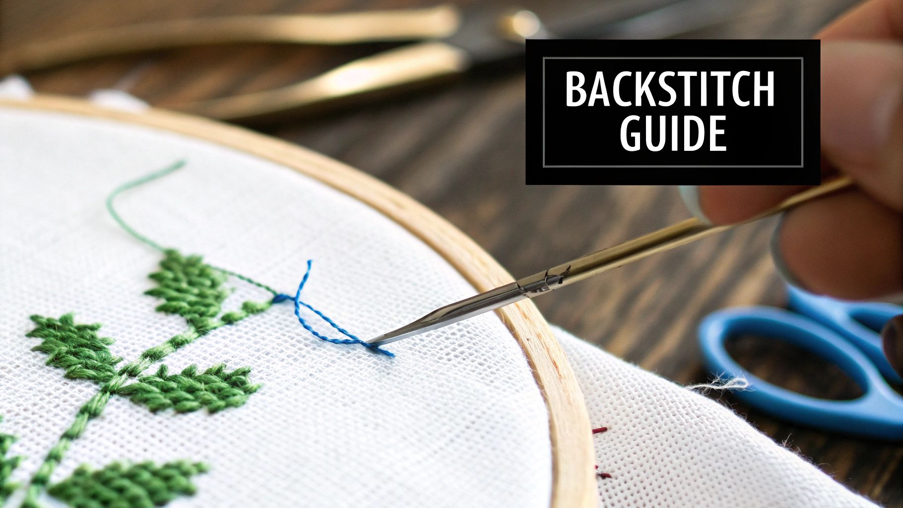 Close-up of embroidery work in progress with green thread and a "BACKSTITCH GUIDE" text box.