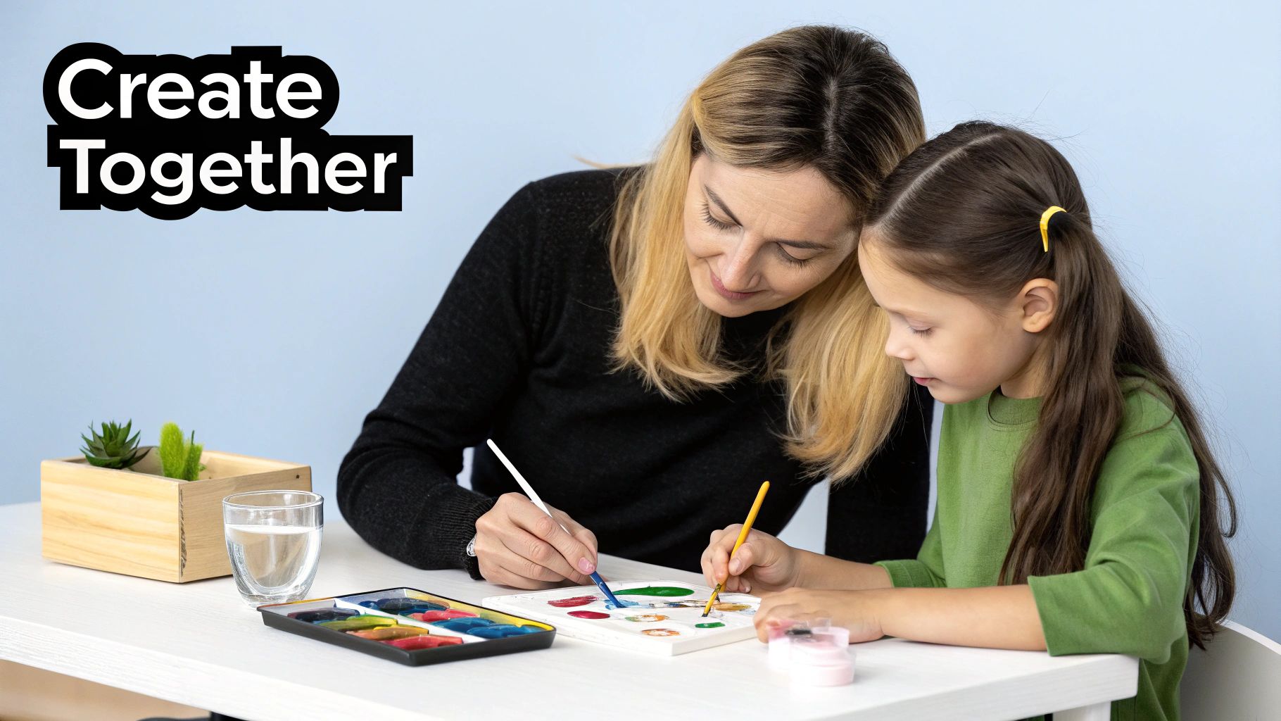 Mother and daughter painting together with watercolors at white table, creative bonding activity