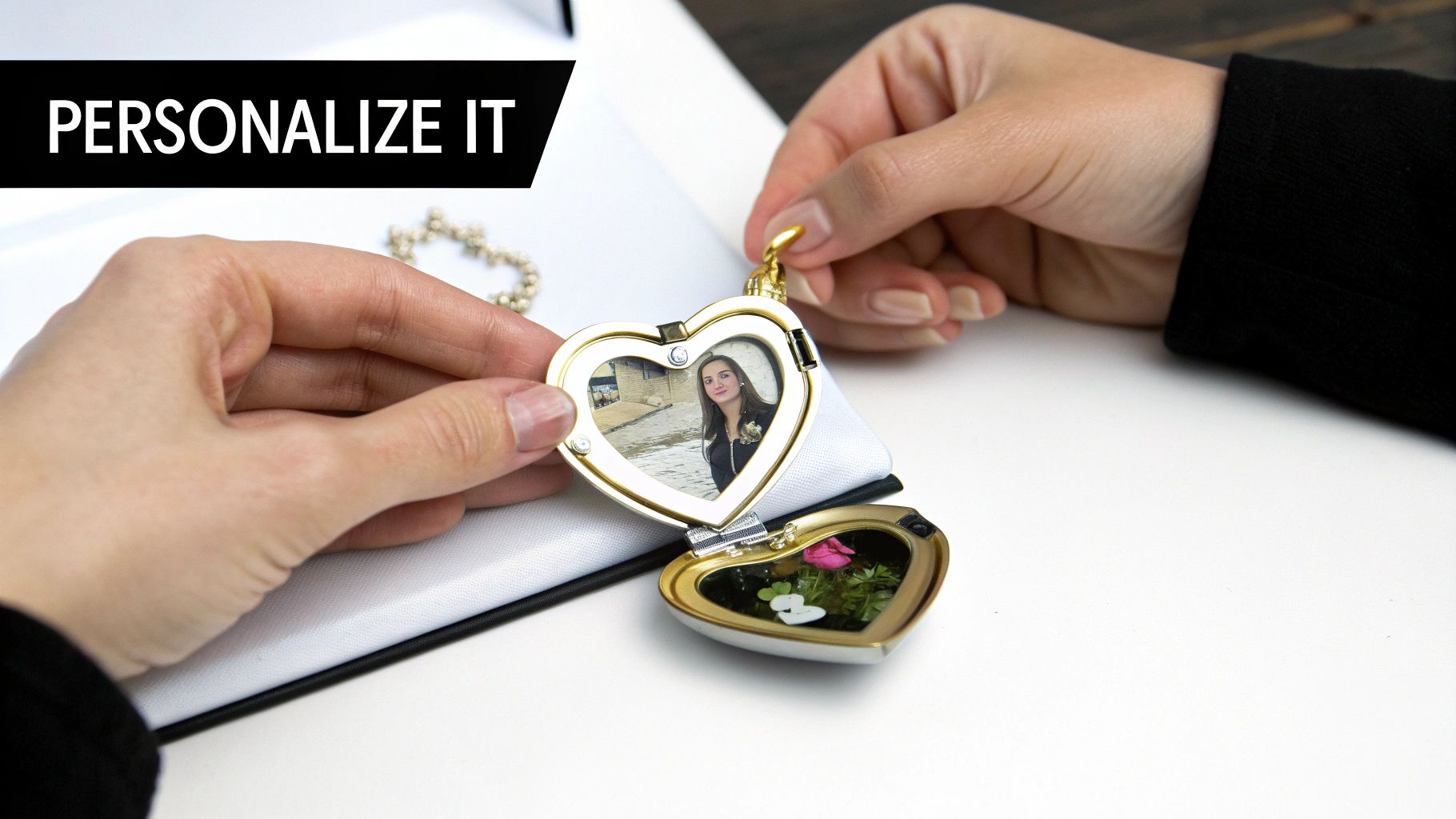 A person holds an open gold heart-shaped locket displaying a woman's photo and dried flowers.