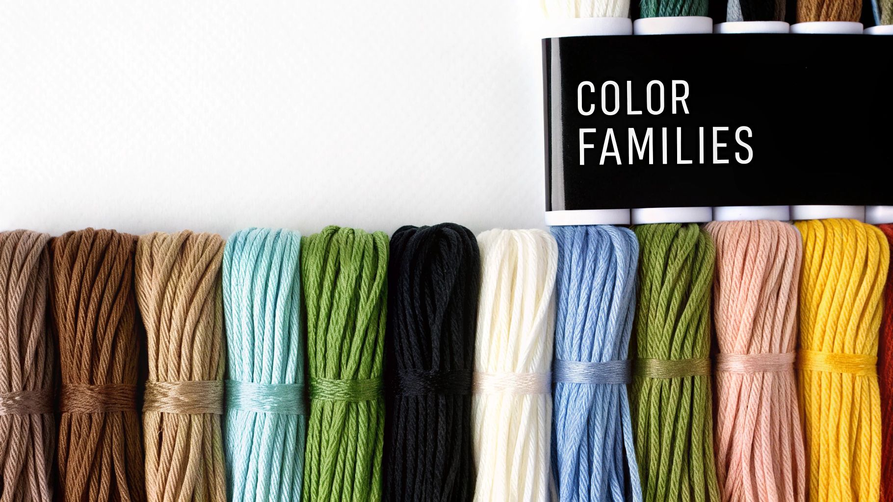 A vibrant collection of DMC threads organized by color