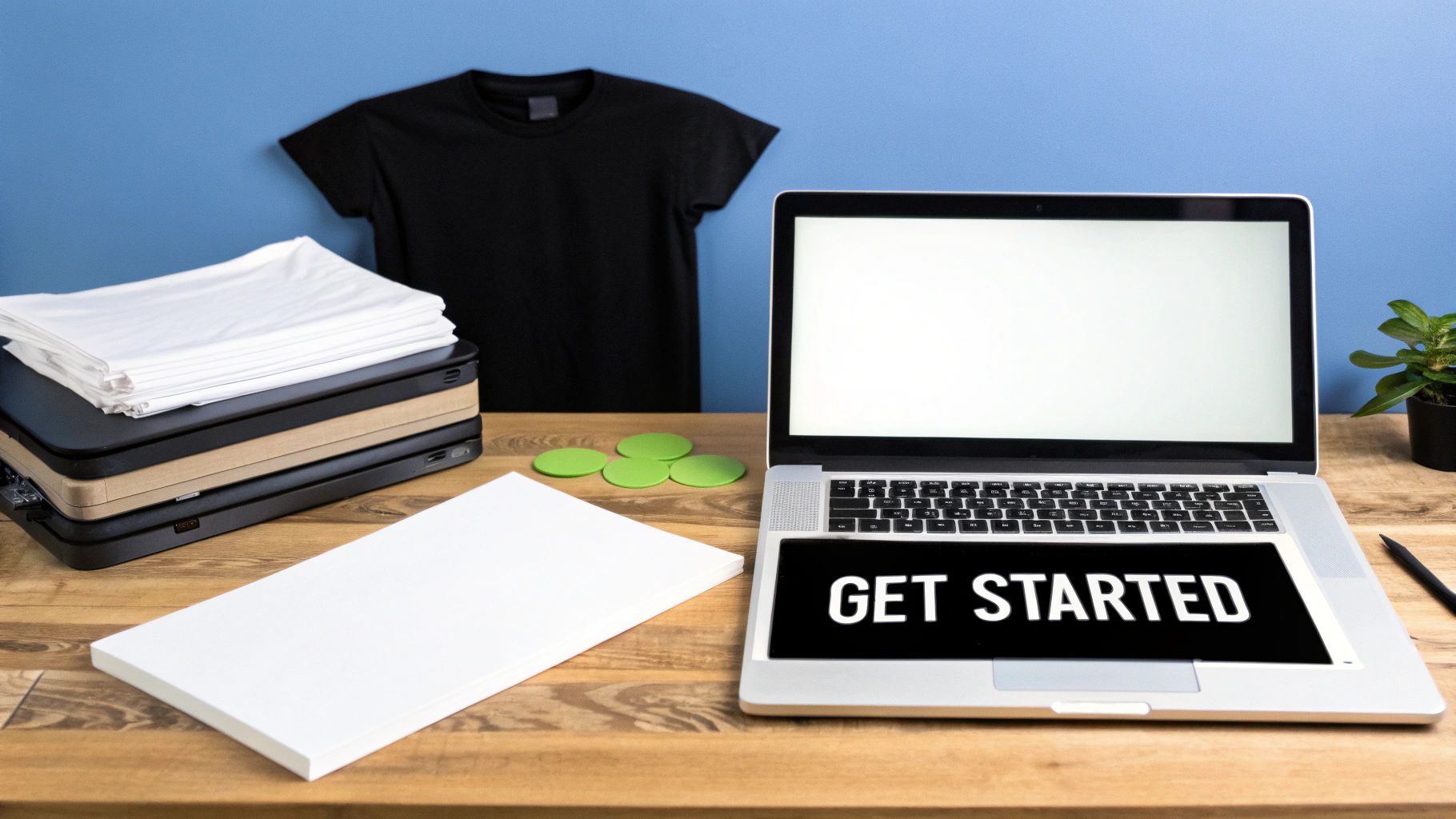 A person peeling transfer paper off a custom-printed t-shirt, revealing a colourful design.