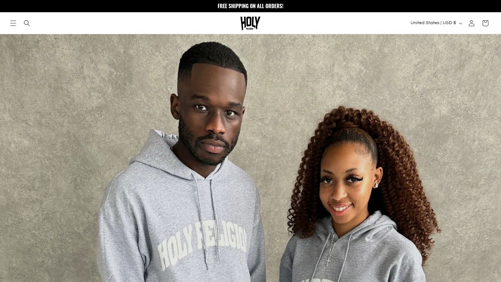 A screenshot of the Holy Religion website homepage, displaying various Christian-themed hoodies and t-shirts.