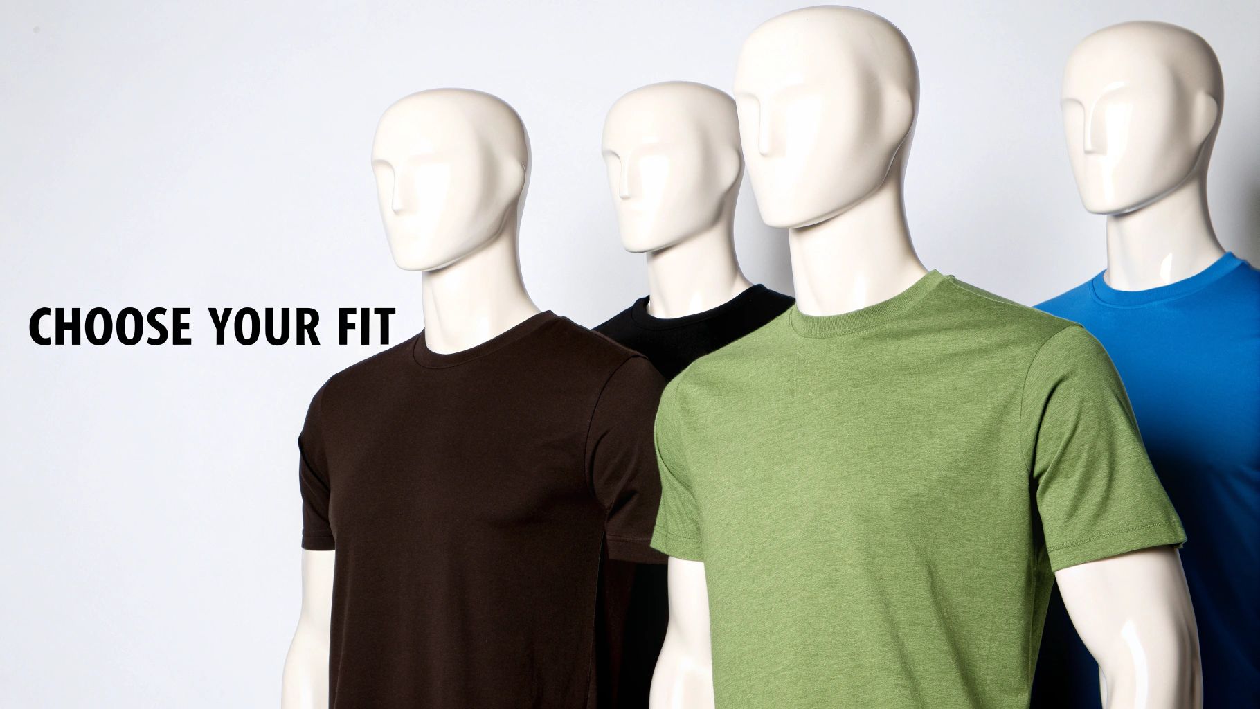 Four white mannequins wearing brown, black, green, and blue t-shirts displaying different fit options