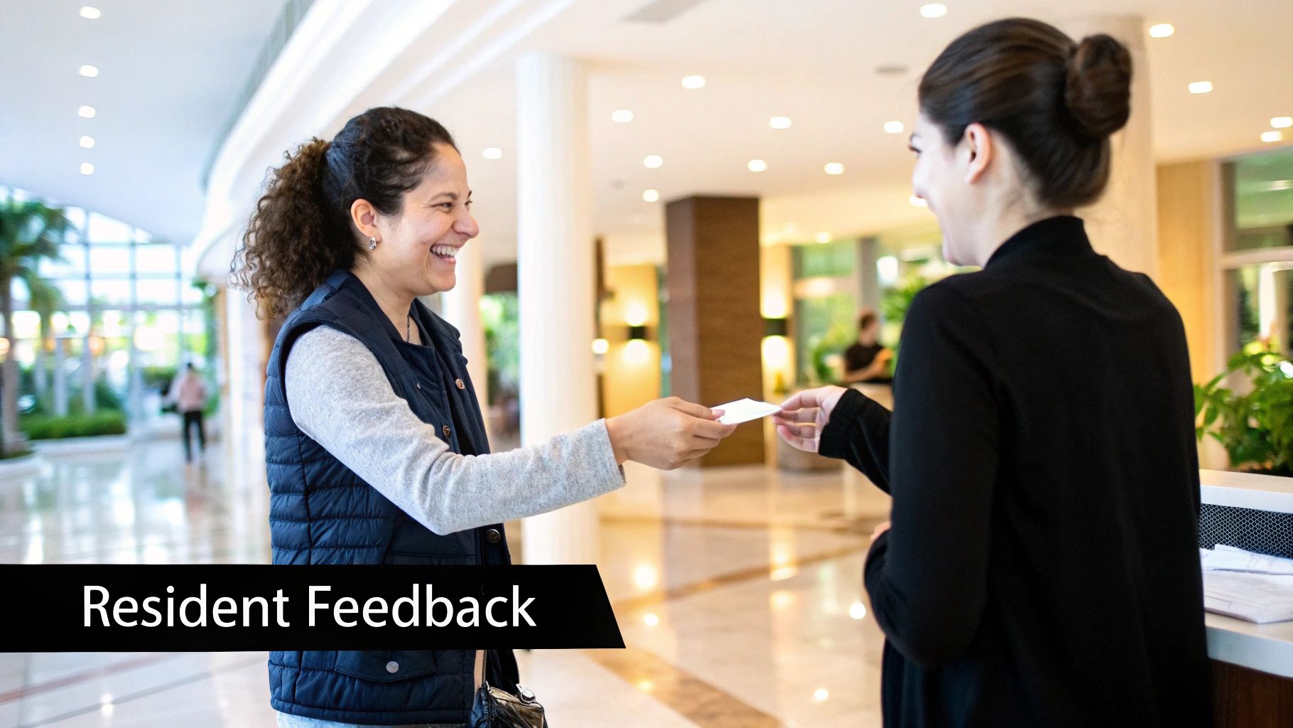 A resident happily leaving a five-star review for their apartment on their smartphone.