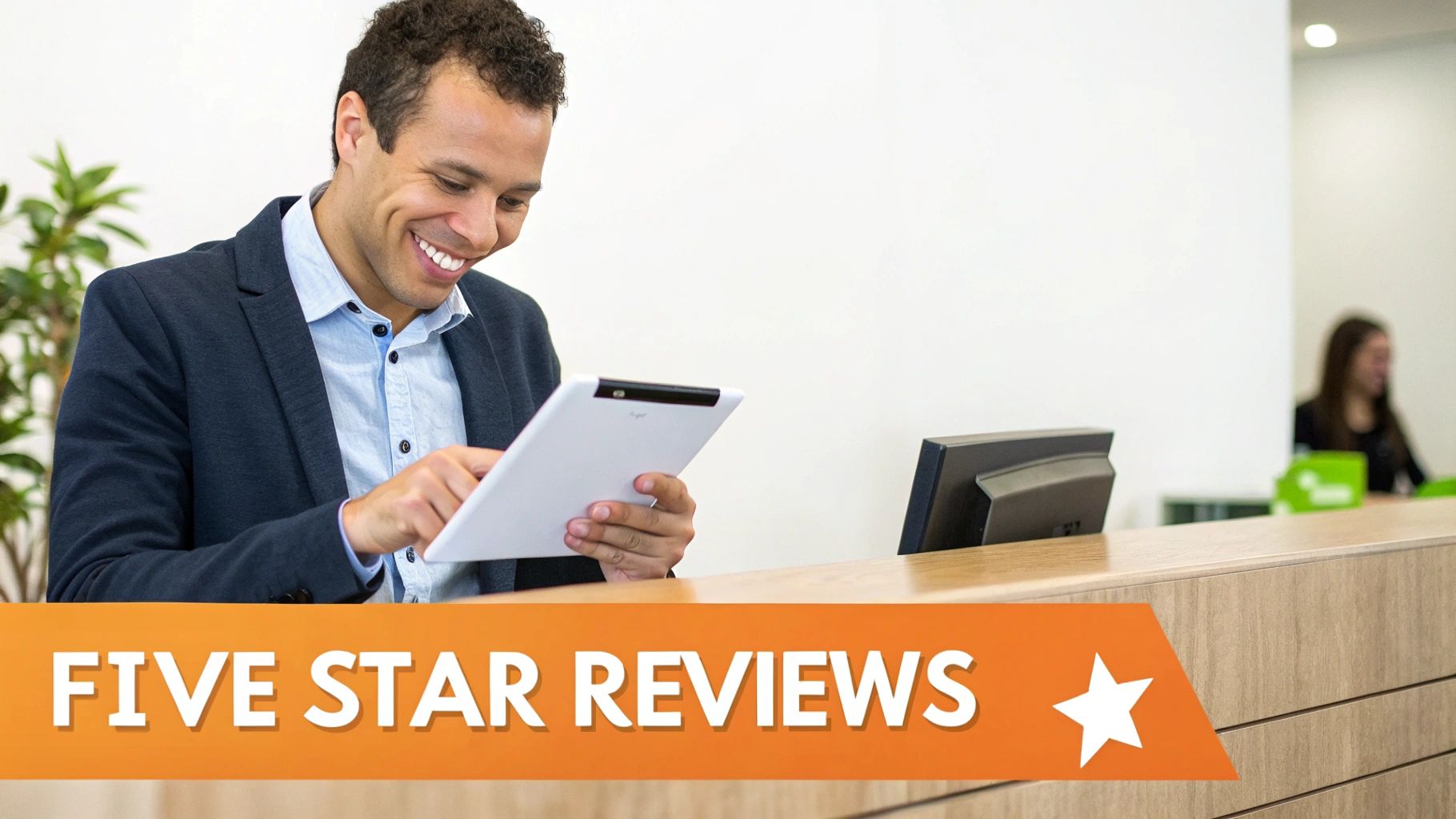 A smiling man in a suit jacket uses a a white tablet at a reception counter, with a "FIVE STAR REVIEWS" banner.