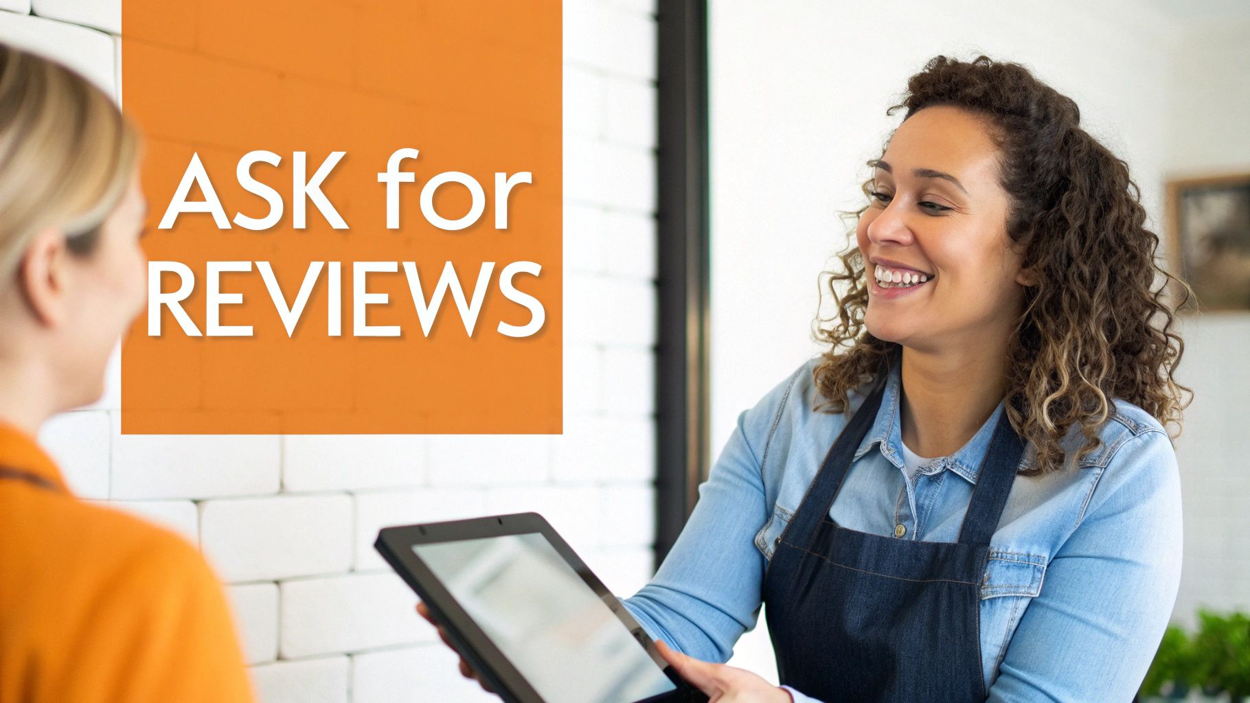 Smiling business owner holding tablet asking customer for online reviews at checkout counter