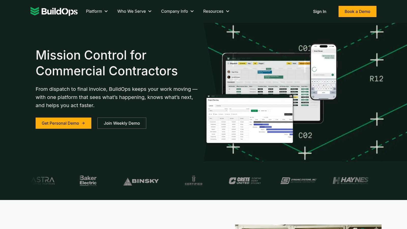 A construction manager using the BuildOps app on a tablet to manage a project.