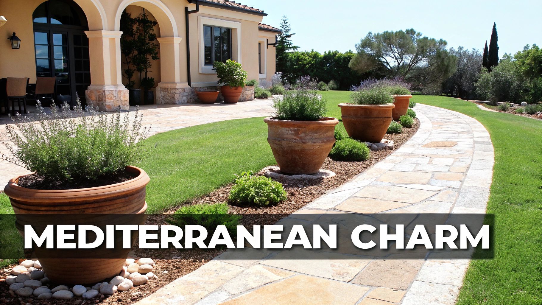 A winding stone path bordered by large terracotta pots with plants in a Mediterranean-style front yard.