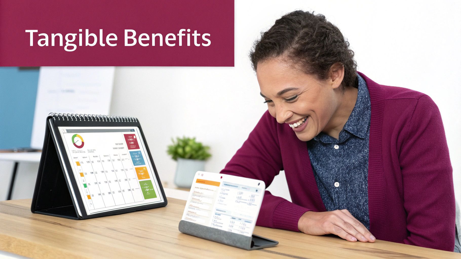A smiling woman reviews data on two digital tablets at a desk, with a 'Tangible Benefits' banner.